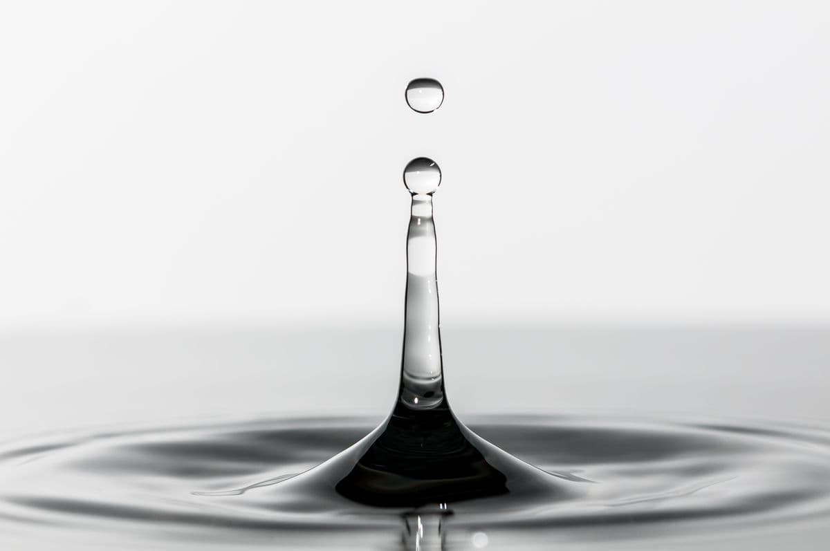 A single water droplet on a still surface
