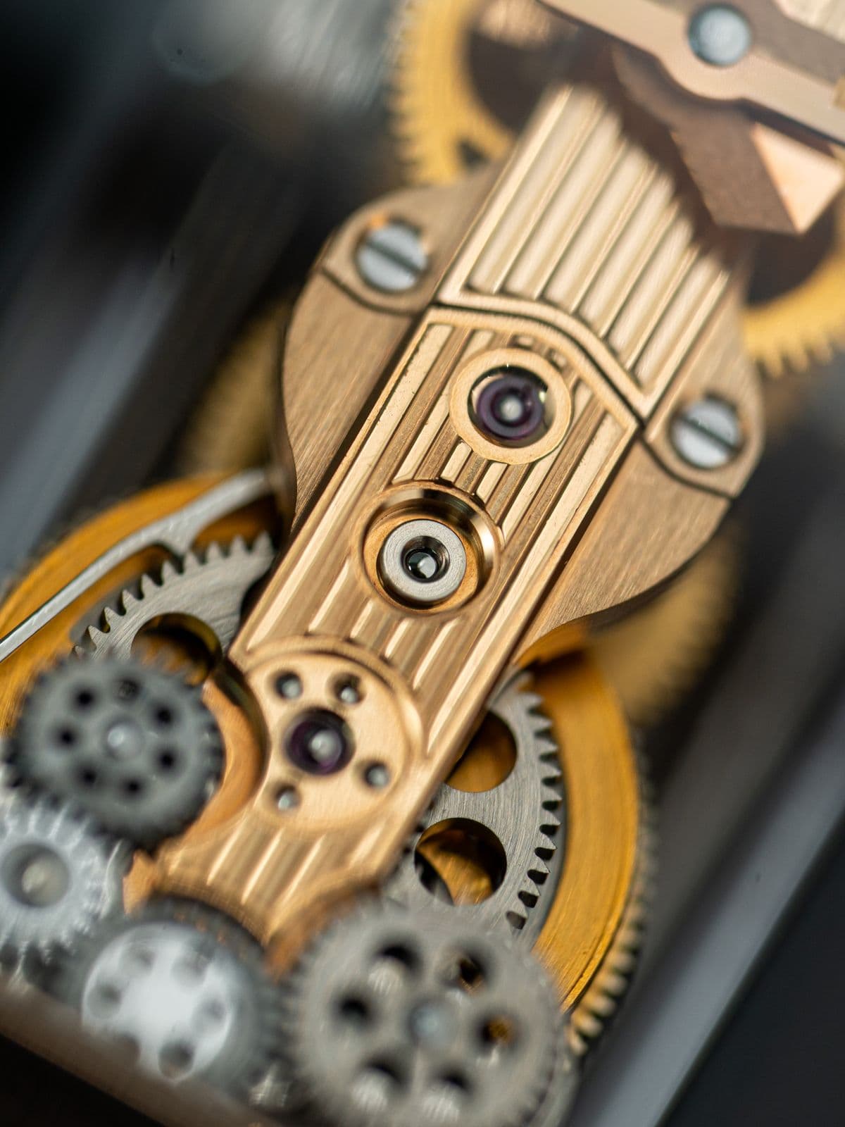The polished gears of a mechanical watch movement