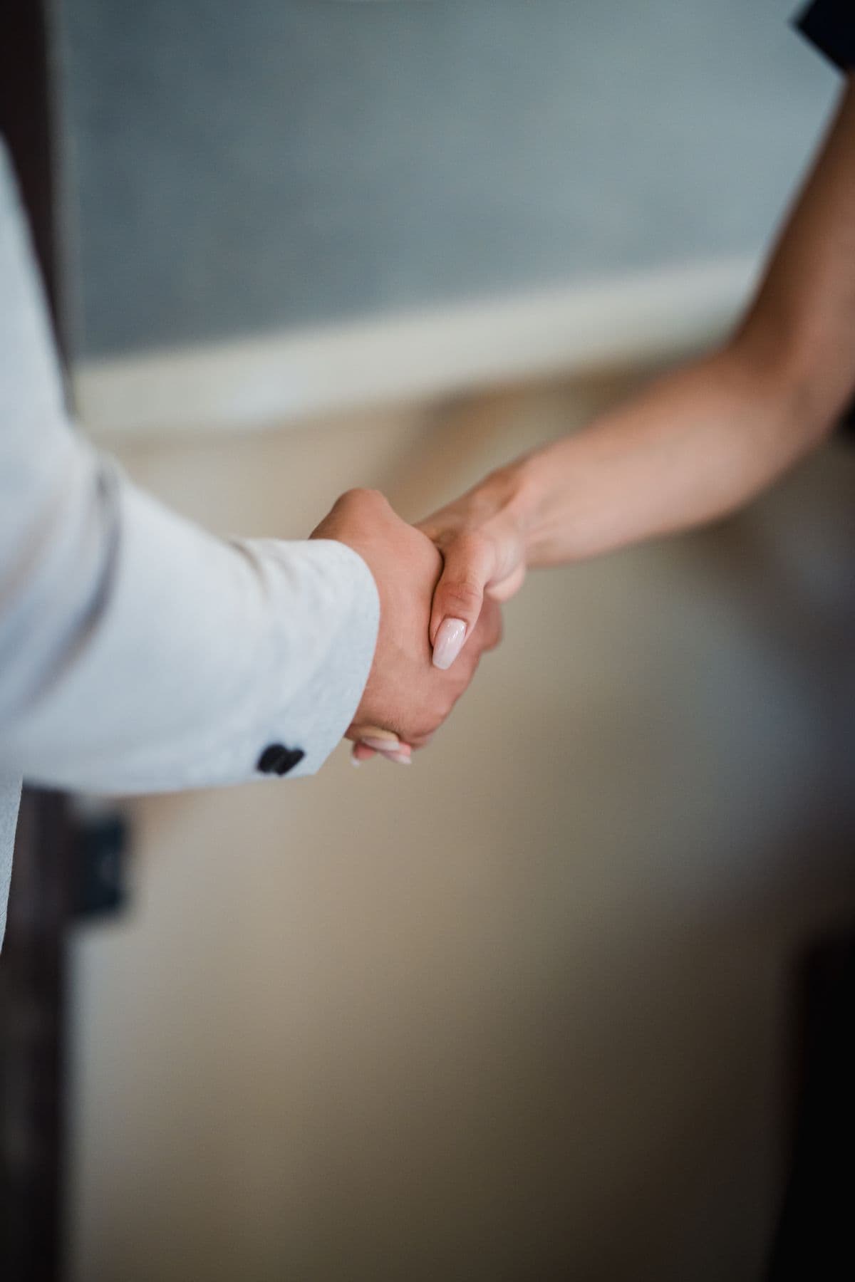 Two people shaking hands on an agreement
