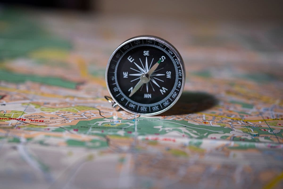 A compass resting on a map